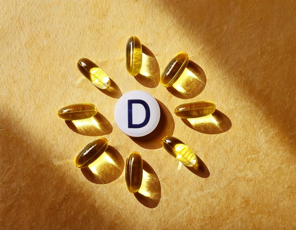 Soleil représenté avec des gélules de vitamine D